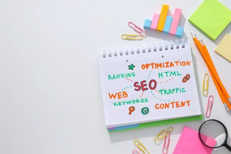 Notebook with SEO strategy keywords like content, traffic, and ranking, representing content marketing strategy planning.