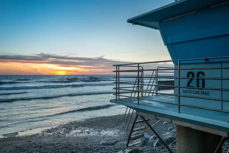 Carlsbad coastal cityscape with ocean views, palm-lined streets, and residential neighborhoods in Southern California.