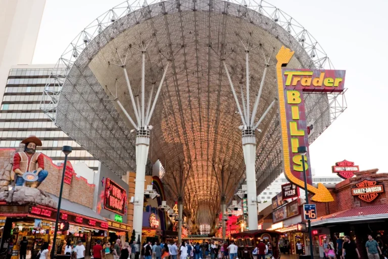 View of the Fremont Street Experience canopy in downtown Las Vegas, featuring illuminated signage and the famous overhead light display structure.